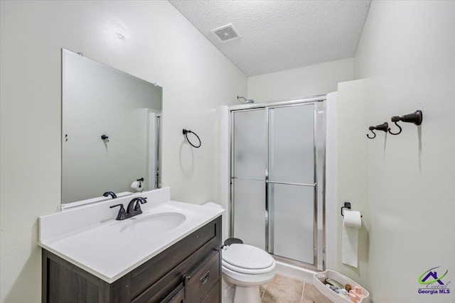 117 Richfield Cir, Kathleen, GA 31047 - bathroom with toilet, a shower stall, vanity, a textured ceiling, and tile patterned flooring
