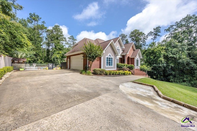 117 Richfield Cir, Kathleen, GA 31047 - view of front facade featuring an attached garage, concrete driveway, and brick siding