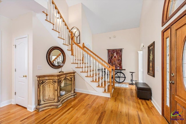 117 Richfield Cir, Kathleen, GA 31047 - entryway with high vaulted ceiling, stairway, light wood-style flooring, and baseboards