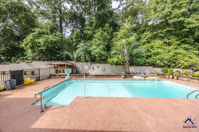 117 Richfield Cir, Kathleen, GA 31047 - view of pool featuring a fenced backyard, view of scattered trees, and a patio area