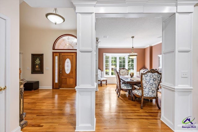 117 Richfield Cir, Kathleen, GA 31047 - entryway featuring light wood finished floors, decorative columns, and crown molding