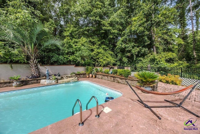 117 Richfield Cir, Kathleen, GA 31047 - view of pool with a fenced backyard, a patio area, and view of wooded area