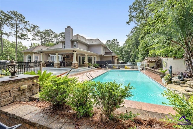 117 Richfield Cir, Kathleen, GA 31047 - view of swimming pool with a fenced backyard and a patio