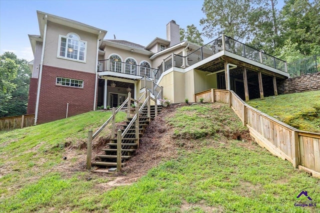 117 Richfield Cir, Kathleen, GA 31047 - rear view of house with stairs, brick siding, a chimney, and a deck