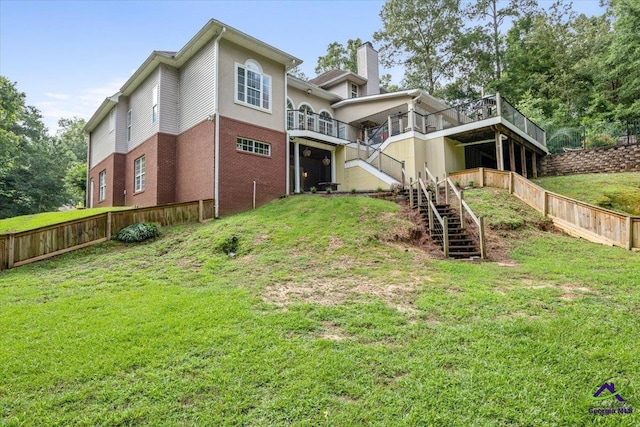117 Richfield Cir, Kathleen, GA 31047 - rear view of property with stairway, brick siding, a chimney, and a wooden deck