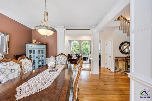 117 Richfield Cir, Kathleen, GA 31047 - dining area with ornate columns, light wood-type flooring, crown molding, and baseboards