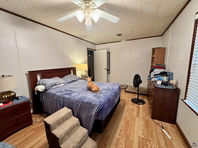 2204 Sheppard Rd, Cordele, GA 31015 - bedroom featuring crown molding, light wood-style flooring, and ceiling fan