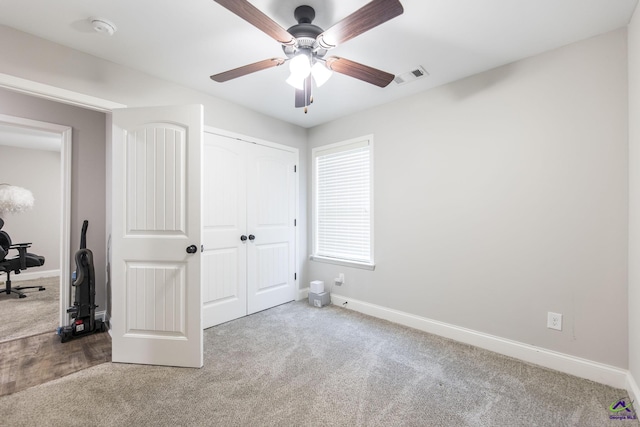 224 Allentown Ln, Macon, GA 31216 - unfurnished bedroom with carpet, baseboards, a closet, and a ceiling fan