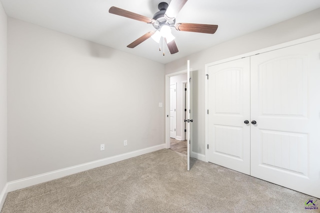 224 Allentown Ln, Macon, GA 31216 - unfurnished bedroom featuring carpet, baseboards, a closet, and a ceiling fan