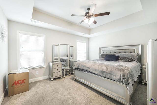 224 Allentown Ln, Macon, GA 31216 - bedroom with a raised ceiling, carpet flooring, baseboards, and a ceiling fan