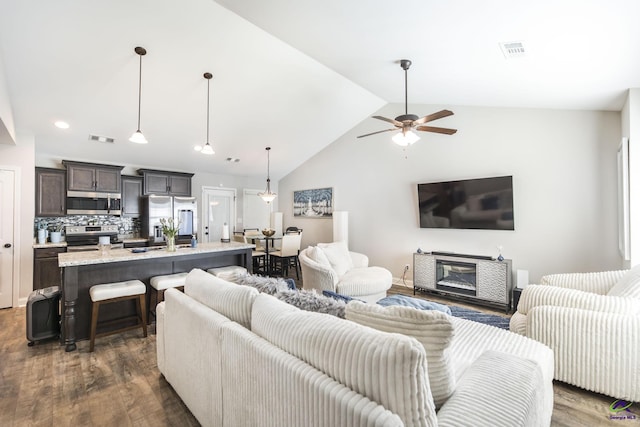 224 Allentown Ln, Macon, GA 31216 - living area featuring dark wood finished floors, lofted ceiling, ceiling fan, and recessed lighting