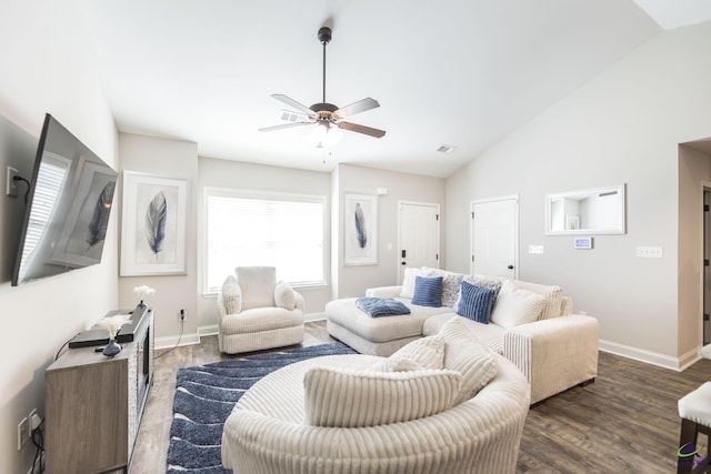 224 Allentown Ln, Macon, GA 31216 - living room featuring lofted ceiling, dark wood-style flooring, baseboards, and a ceiling fan