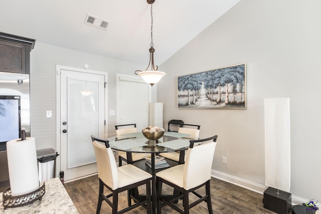224 Allentown Ln, Macon, GA 31216 - dining room featuring dark wood-style floors, lofted ceiling, and baseboards