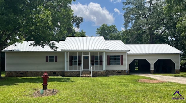 571 Duncan Ave, Unadilla, GA 31091 - view of front of property featuring a front yard, metal roof, driveway, and crawl space