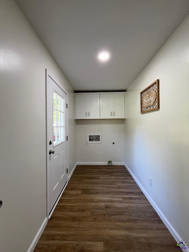 571 Duncan Ave, Unadilla, GA 31091 - washroom featuring washer hookup, electric dryer hookup, baseboards, dark wood-style flooring, and cabinet space