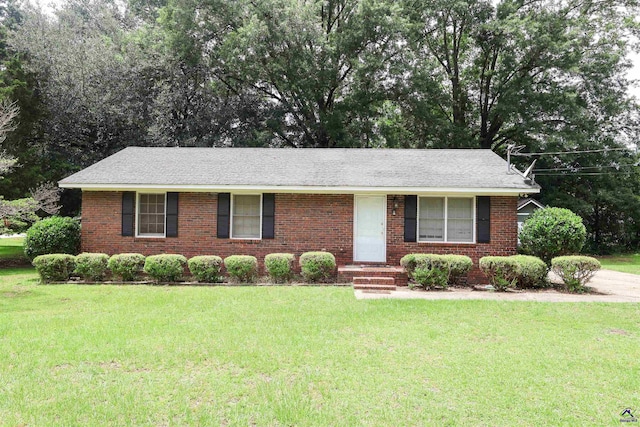 901 Ross St, Perry, GA 31069 - ranch-style house featuring a front lawn and brick siding