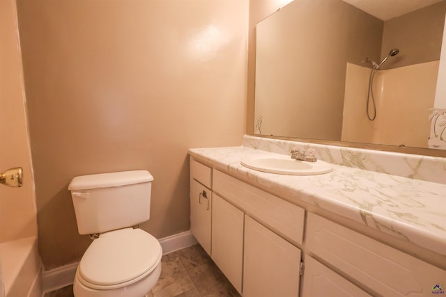 901 Ross St, Perry, GA 31069 - bathroom featuring toilet, vanity, marble look tile flooring, baseboards, and a shower