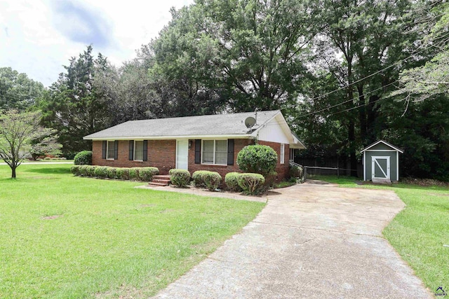 901 Ross St, Perry, GA 31069 - ranch-style home with a front lawn, concrete driveway, and brick siding