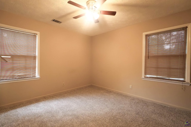 901 Ross St, Perry, GA 31069 - carpeted spare room featuring a ceiling fan, a textured ceiling, and baseboards