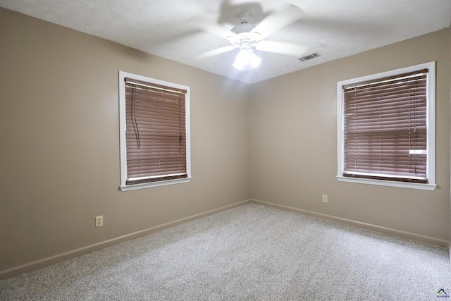 901 Ross St, Perry, GA 31069 - carpeted spare room featuring ceiling fan and baseboards
