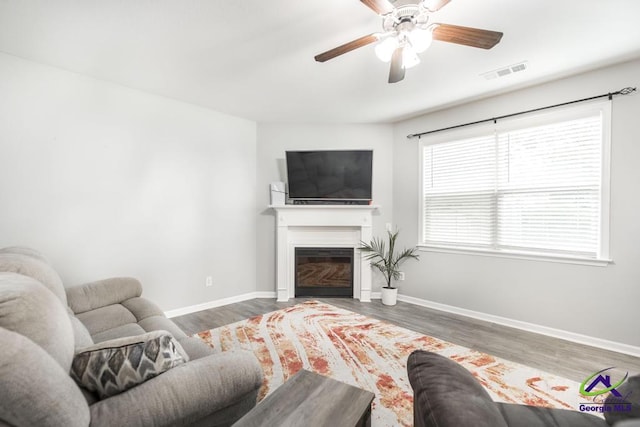 318 Flowing Meadows Dr, Bonaire, GA 31047 - living area featuring wood finished floors, a ceiling fan, and baseboards