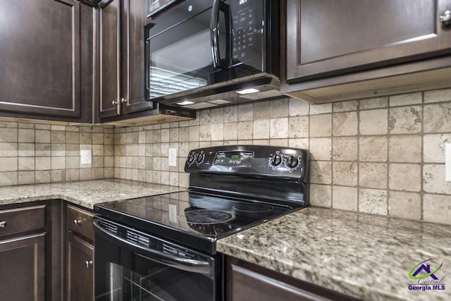 318 Flowing Meadows Dr, Bonaire, GA 31047 - kitchen with black appliances, dark brown cabinets, tasteful backsplash, and light stone countertops