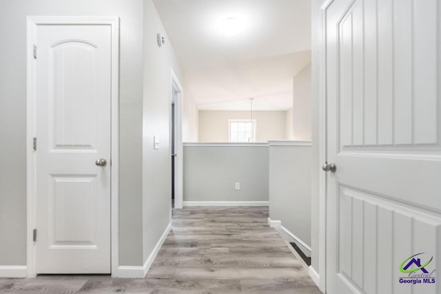 318 Flowing Meadows Dr, Bonaire, GA 31047 - hallway with wood finished floors and baseboards