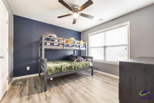 318 Flowing Meadows Dr, Bonaire, GA 31047 - bedroom with baseboards, wood finished floors, and ceiling fan