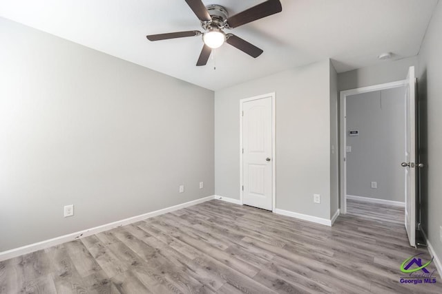 318 Flowing Meadows Dr, Bonaire, GA 31047 - unfurnished bedroom with wood finished floors, baseboards, and a ceiling fan