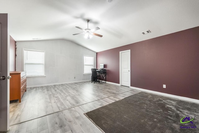 318 Flowing Meadows Dr, Bonaire, GA 31047 - unfurnished room featuring ceiling fan, lofted ceiling, a desk, baseboards, and light wood-type flooring