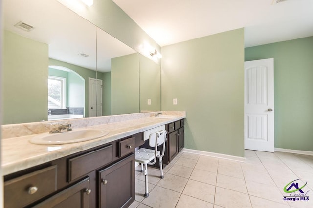 318 Flowing Meadows Dr, Bonaire, GA 31047 - full bath featuring double vanity, tile patterned flooring, and baseboards