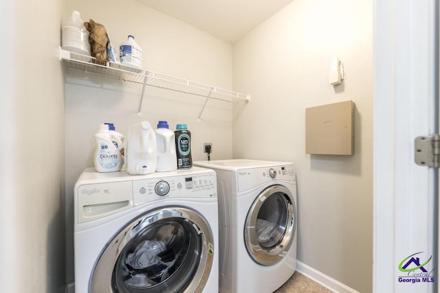 318 Flowing Meadows Dr, Bonaire, GA 31047 - laundry room with washing machine and clothes dryer and baseboards