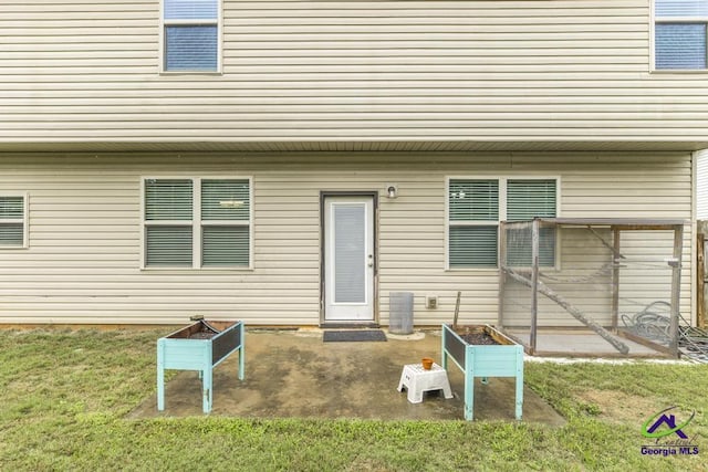 318 Flowing Meadows Dr, Bonaire, GA 31047 - back of house featuring a patio and a yard