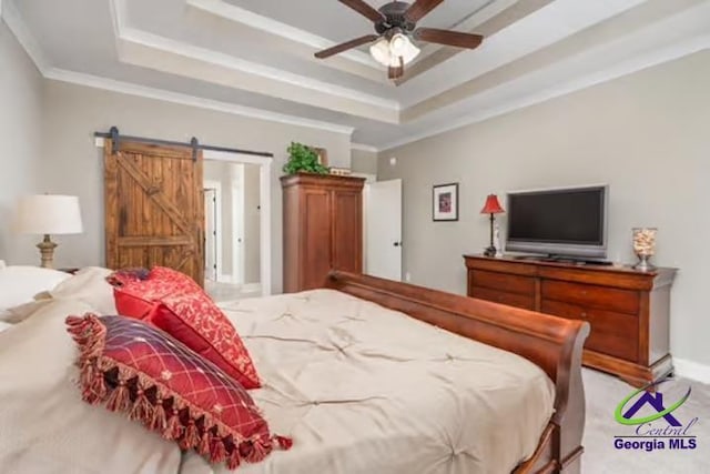 204 Bobtail Run, Kathleen, GA 31047 - bedroom featuring a tray ceiling, crown molding, a barn door, light carpet, and ceiling fan