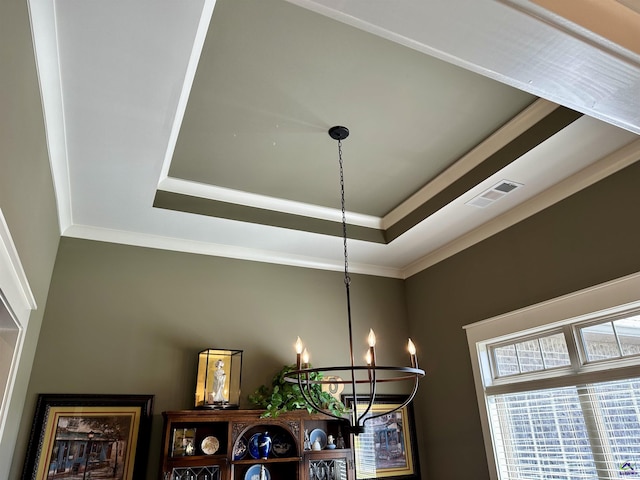 204 Bobtail Run, Kathleen, GA 31047 - detailed view of a chandelier, a raised ceiling, and crown molding