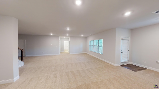 444 Southern Oaks Dr, Macon, GA 31216 - unfurnished room with light carpet, recessed lighting, baseboards, and stairs