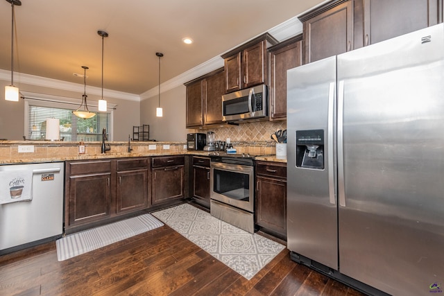 230 Misty Valley Ln, Bonaire, GA 31005 - kitchen featuring appliances with stainless steel finishes, dark wood-style flooring, dark brown cabinets, tasteful backsplash, and ornamental molding