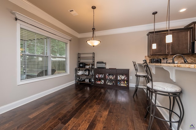 230 Misty Valley Ln, Bonaire, GA 31005 - dining area featuring dark wood-style floors and ornamental molding