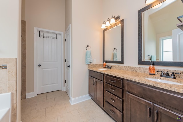 230 Misty Valley Ln, Bonaire, GA 31005 - full bath featuring double vanity, a bath, and tile patterned flooring