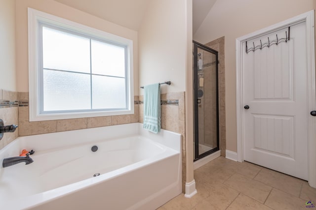 230 Misty Valley Ln, Bonaire, GA 31005 - bathroom with a bath, a stall shower, and tile patterned flooring