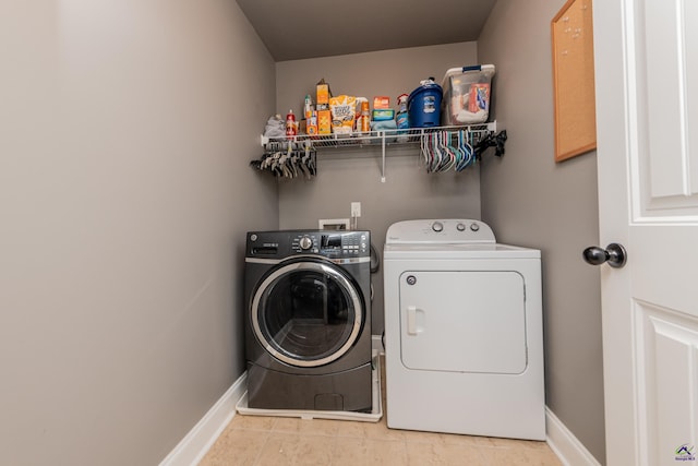 230 Misty Valley Ln, Bonaire, GA 31005 - laundry room featuring washer and dryer and light tile patterned flooring