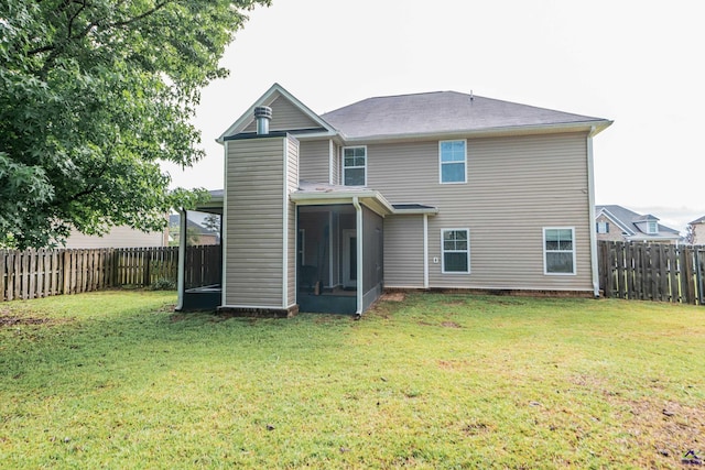 230 Misty Valley Ln, Bonaire, GA 31005 - rear view of house with a sunroom and a fenced backyard