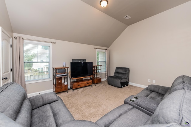 230 Misty Valley Ln, Bonaire, GA 31005 - carpeted living area featuring lofted ceiling and baseboards