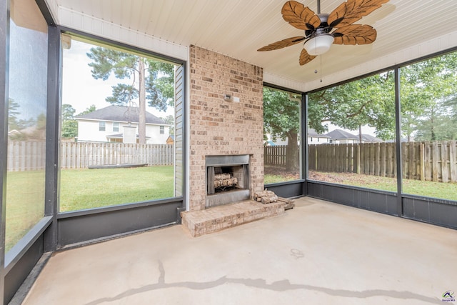 230 Misty Valley Ln, Bonaire, GA 31005 - unfurnished sunroom featuring a brick fireplace, a ceiling fan, and plenty of natural light