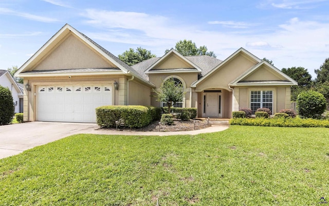 111 Venus Way, Bonaire, GA 31005 - ranch-style house with concrete driveway, an attached garage, stucco siding, and a front yard