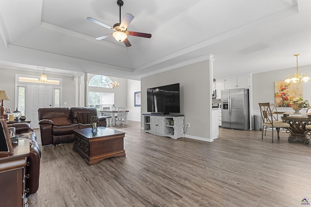 111 Venus Way, Bonaire, GA 31005 - living area with a raised ceiling, a chandelier, healthy amount of natural light, and dark wood-style floors