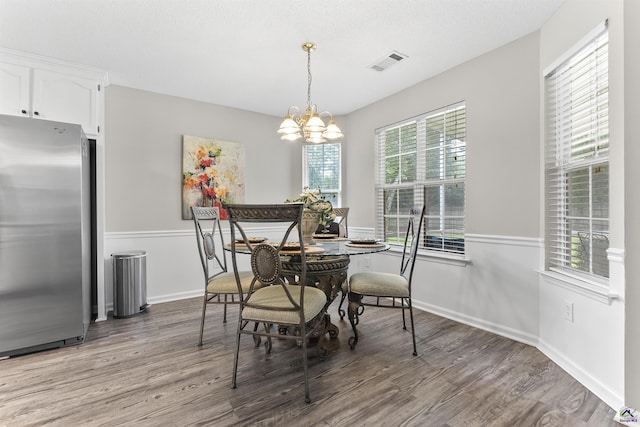 111 Venus Way, Bonaire, GA 31005 - dining space with light wood finished floors and a chandelier