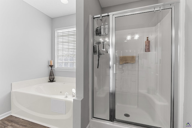 111 Venus Way, Bonaire, GA 31005 - full bath with a shower stall, a tub with jets, and wood finished floors