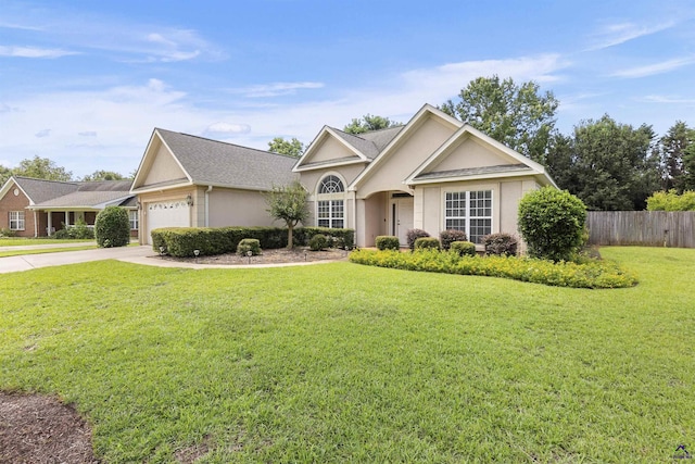 111 Venus Way, Bonaire, GA 31005 - view of front facade with stucco siding, an attached garage, and concrete driveway