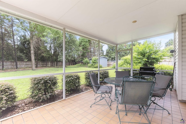 111 Venus Way, Bonaire, GA 31005 - sunroom featuring outdoor dining space and view of scattered trees